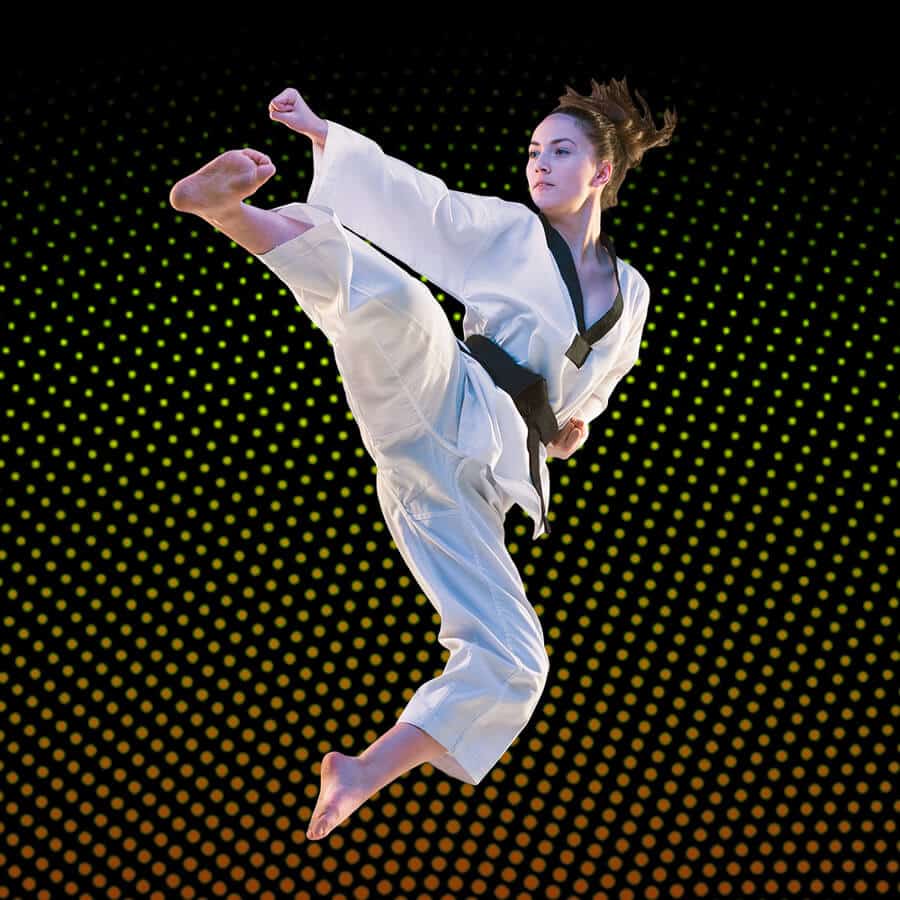 Martial Arts Lessons for Adults in Apex NC - Girl Black Belt Jumping High Kick